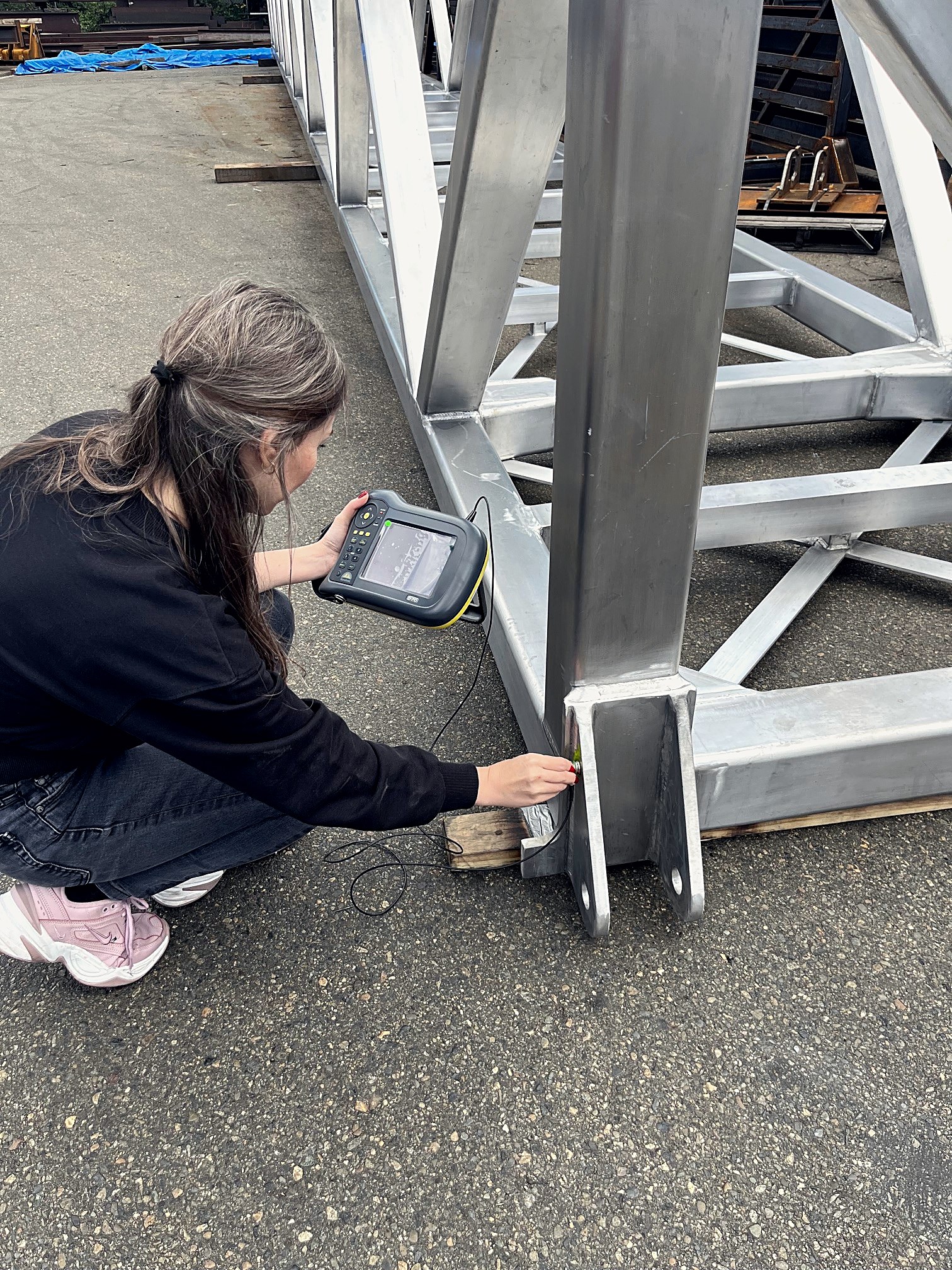 Ultrasonic testing on a steel walkway prior to shipment