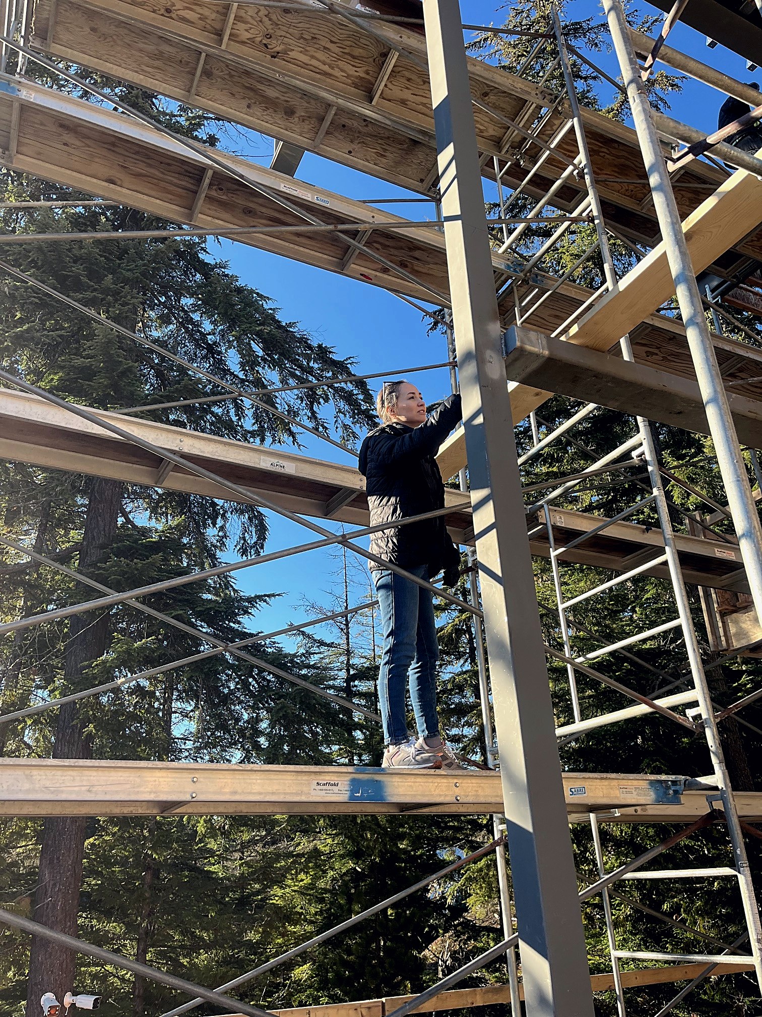 Noble Testing inspector examining a welded joint on a residential scaffold in Whistler